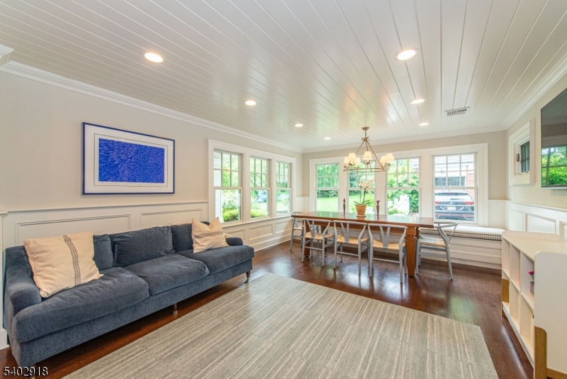 412 Ridgewood Avenue Glen Ridge, NJ 07028 - Photo 11 of 48 a living room with furniture a large window and wooden floor