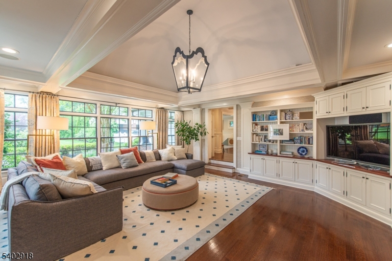 412 Ridgewood Avenue Glen Ridge, NJ 07028 - Photo 12 of 48 a living room with furniture and a flat screen tv