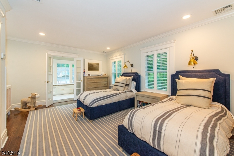 412 Ridgewood Avenue Glen Ridge, NJ 07028 - Photo 29 of 48 a bedroom with two beds and a large window