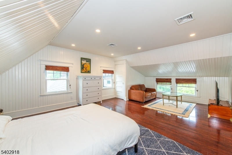 412 Ridgewood Avenue Glen Ridge, NJ 07028 - Photo 32 of 48 a bedroom with a bed and a large window