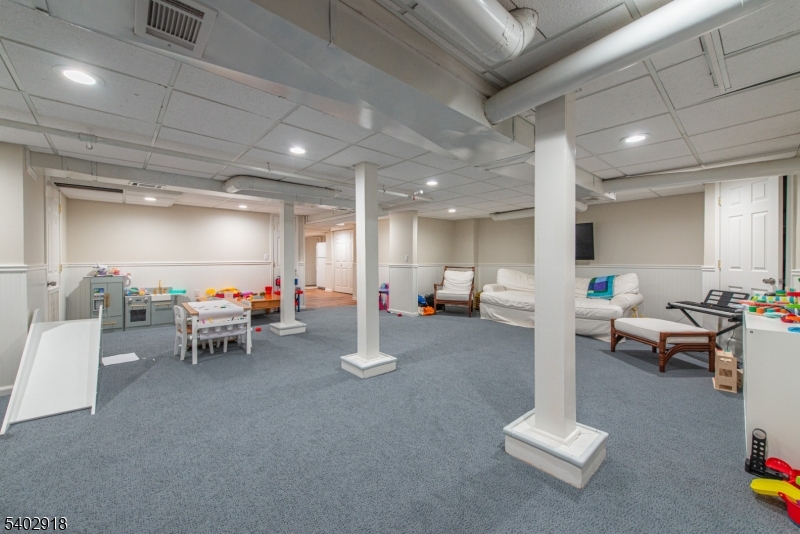 412 Ridgewood Avenue Glen Ridge, NJ 07028 - Photo 36 of 48 a living room with furniture and a table