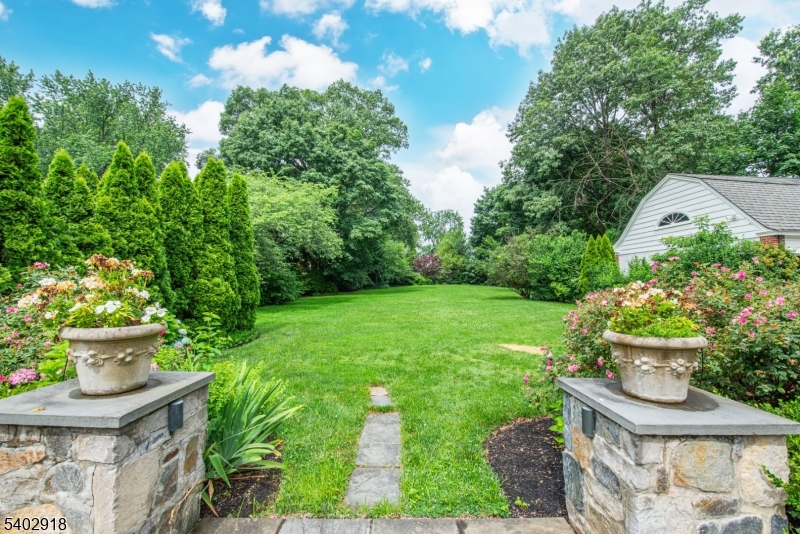 412 Ridgewood Avenue Glen Ridge, NJ 07028 - Photo 45 of 48 a view of a house with a yard and garden