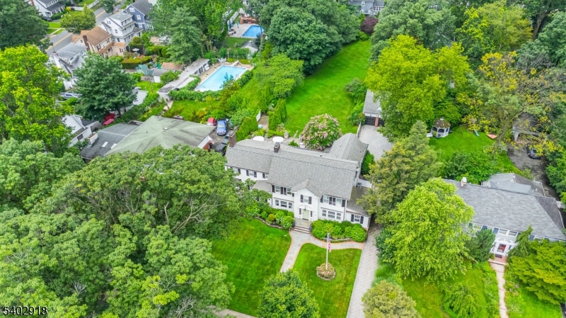 412 Ridgewood Avenue Glen Ridge, NJ 07028 - Photo 47 of 48 an aerial view of residential house with outdoor space and trees all around