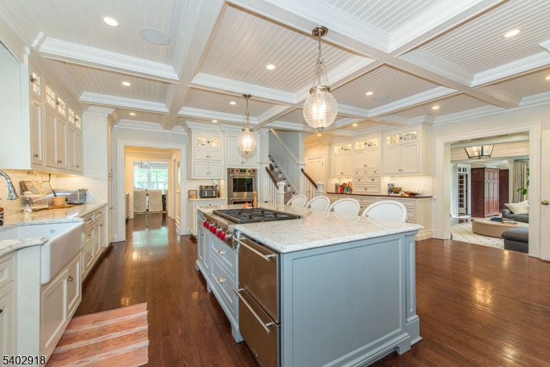 412 Ridgewood Avenue Glen Ridge, NJ 07028 - Photo 9 of 48 a kitchen with a stove and a wooden floor