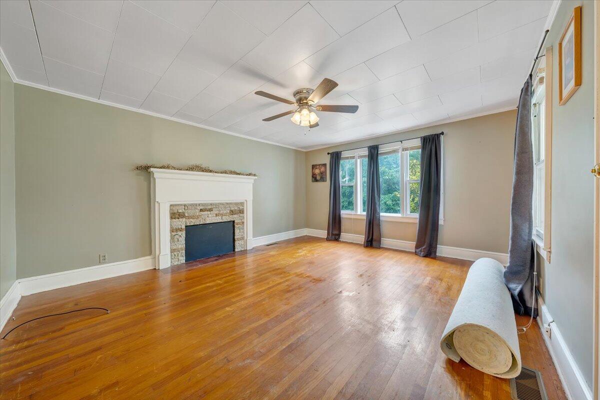 4393 Daugherty Road Salem, VA 24153 - Photo 2 of 24 a view of an empty room with a fireplace and a window