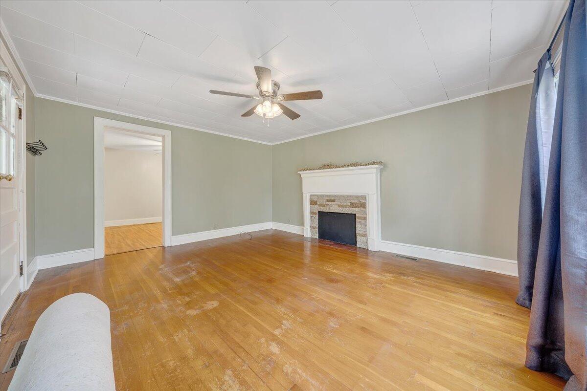 4393 Daugherty Road Salem, VA 24153 - Photo 3 of 24 a view of livingroom with a ceiling fan and a fireplace