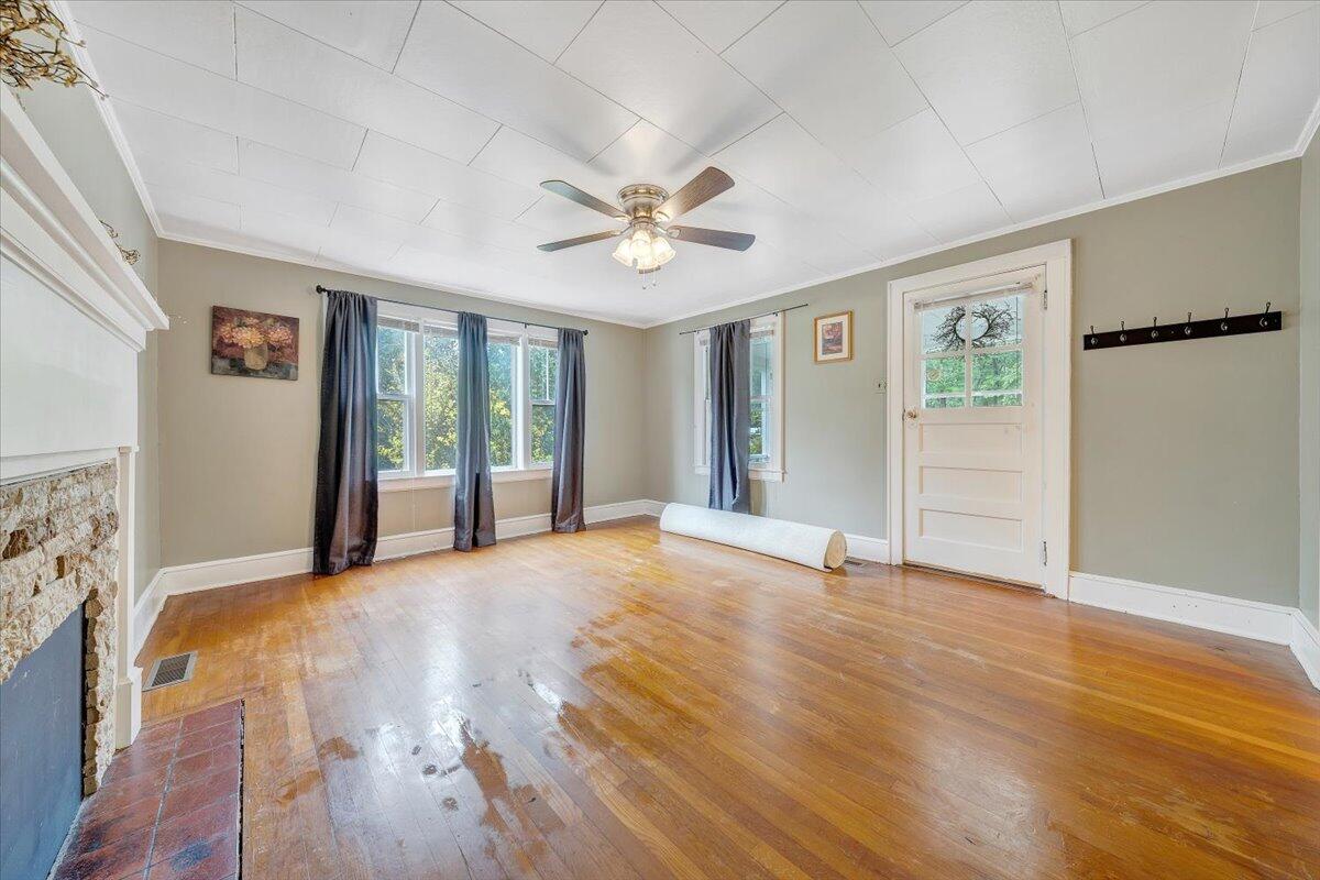 4393 Daugherty Road Salem, VA 24153 - Photo 4 of 24 a view of an empty room with window and wooden floor
