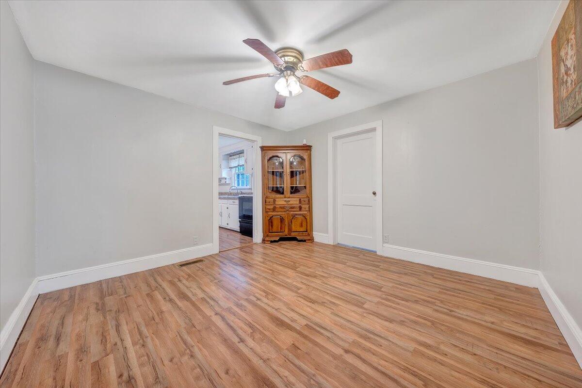 4393 Daugherty Road Salem, VA 24153 - Photo 5 of 24 wooden floor in an empty room with a window