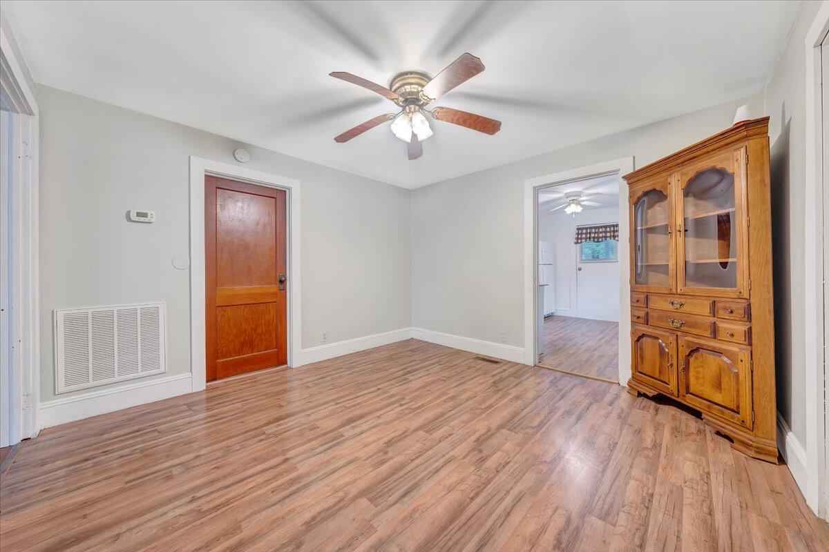 4393 Daugherty Road Salem, VA 24153 - Photo 6 of 24 wooden floor in an empty room with a window