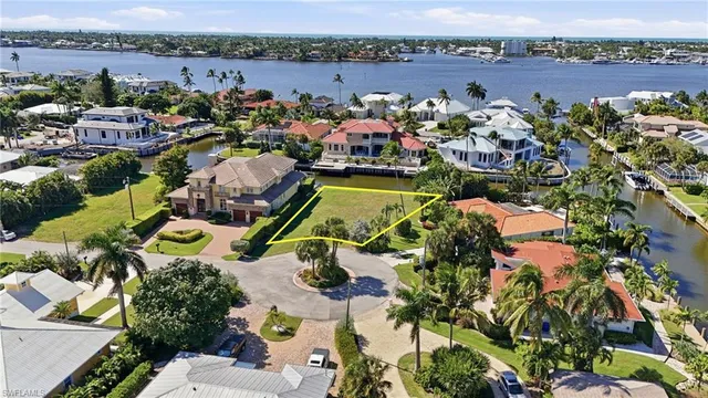 an aerial view of a house with a swimming pool yard and outdoor seating