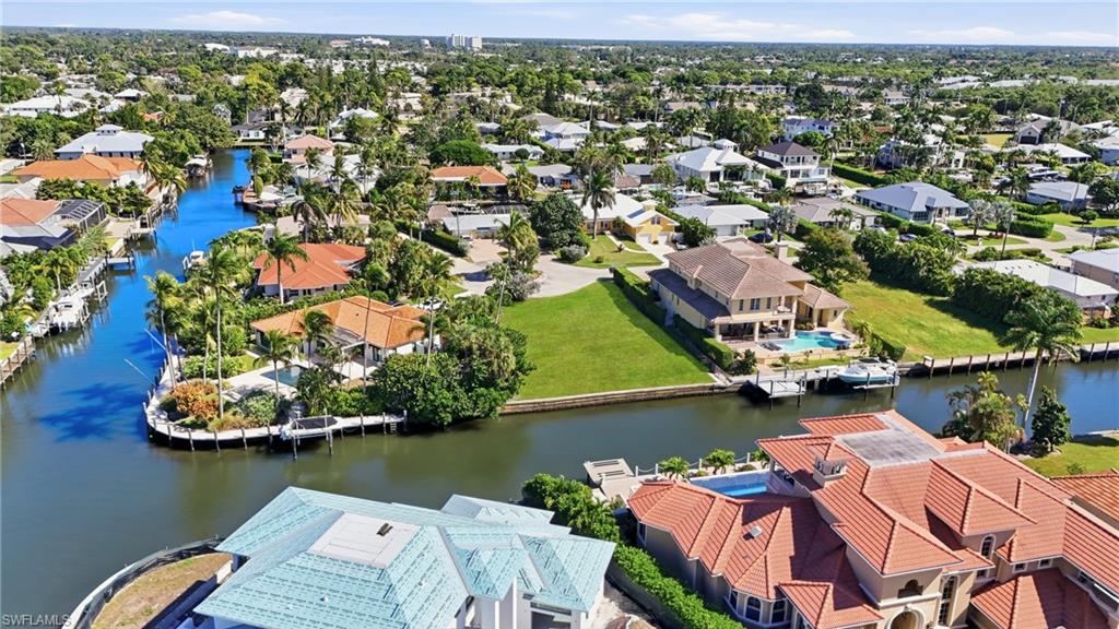 1510 Mullet Lane Naples, FL 34102 - Photo 8 of 8 an aerial view of a house with a lake view