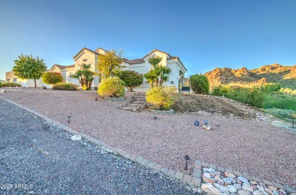 a kitchen with stainless steel appliances granite countertop a stove microwave and refrigerator