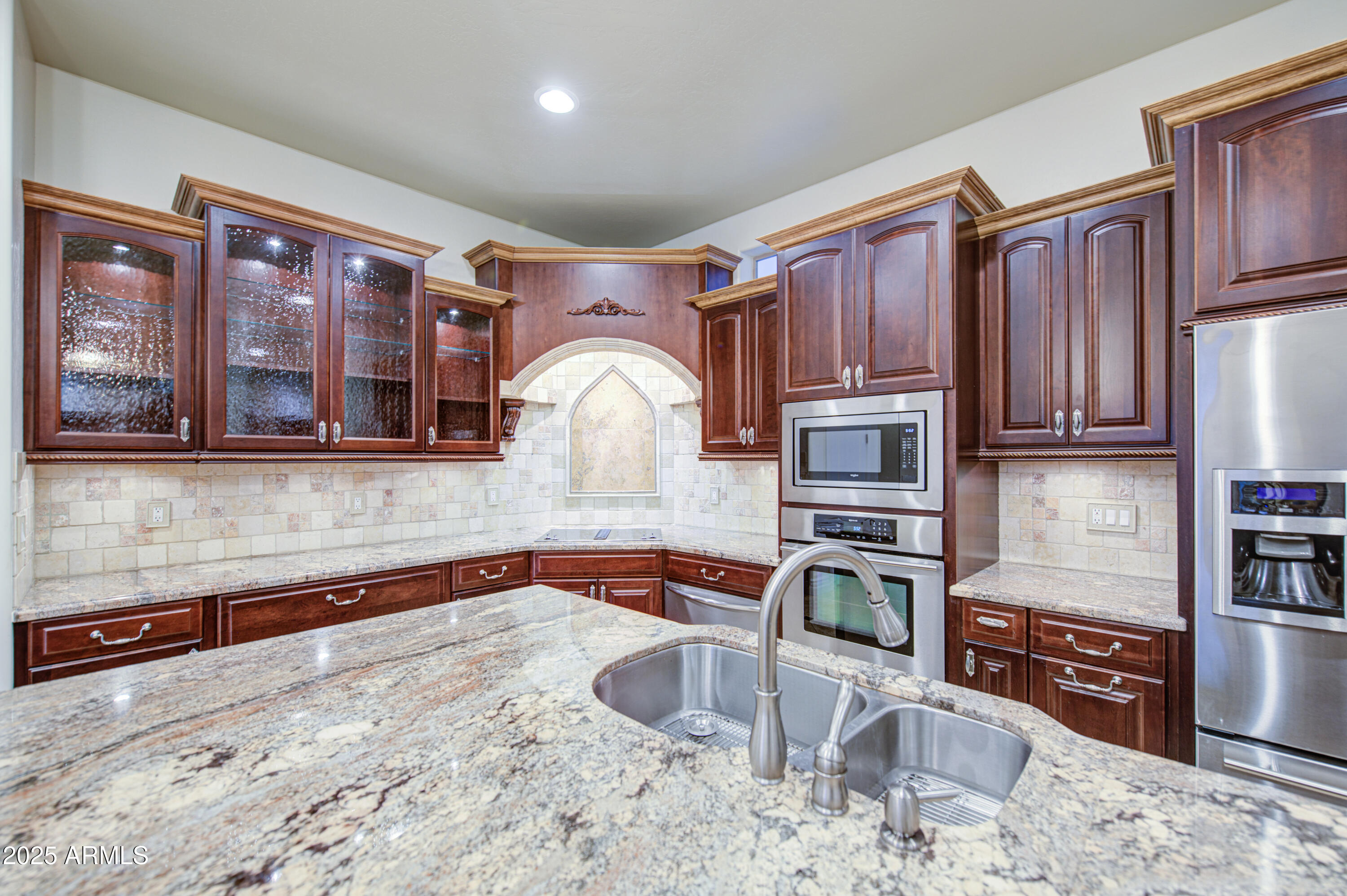 5238 North Explorer Road Apache Junction, AZ 85119 - Photo 26 of 109 a kitchen with stainless steel appliances granite countertop a stove sink and microwave