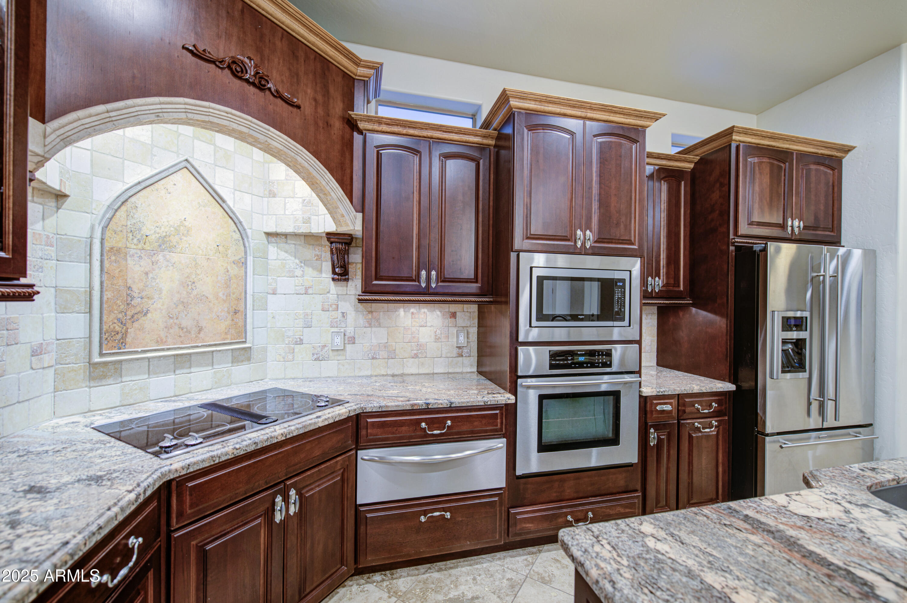 5238 North Explorer Road Apache Junction, AZ 85119 - Photo 27 of 109 a kitchen with stainless steel appliances granite countertop a stove microwave and refrigerator