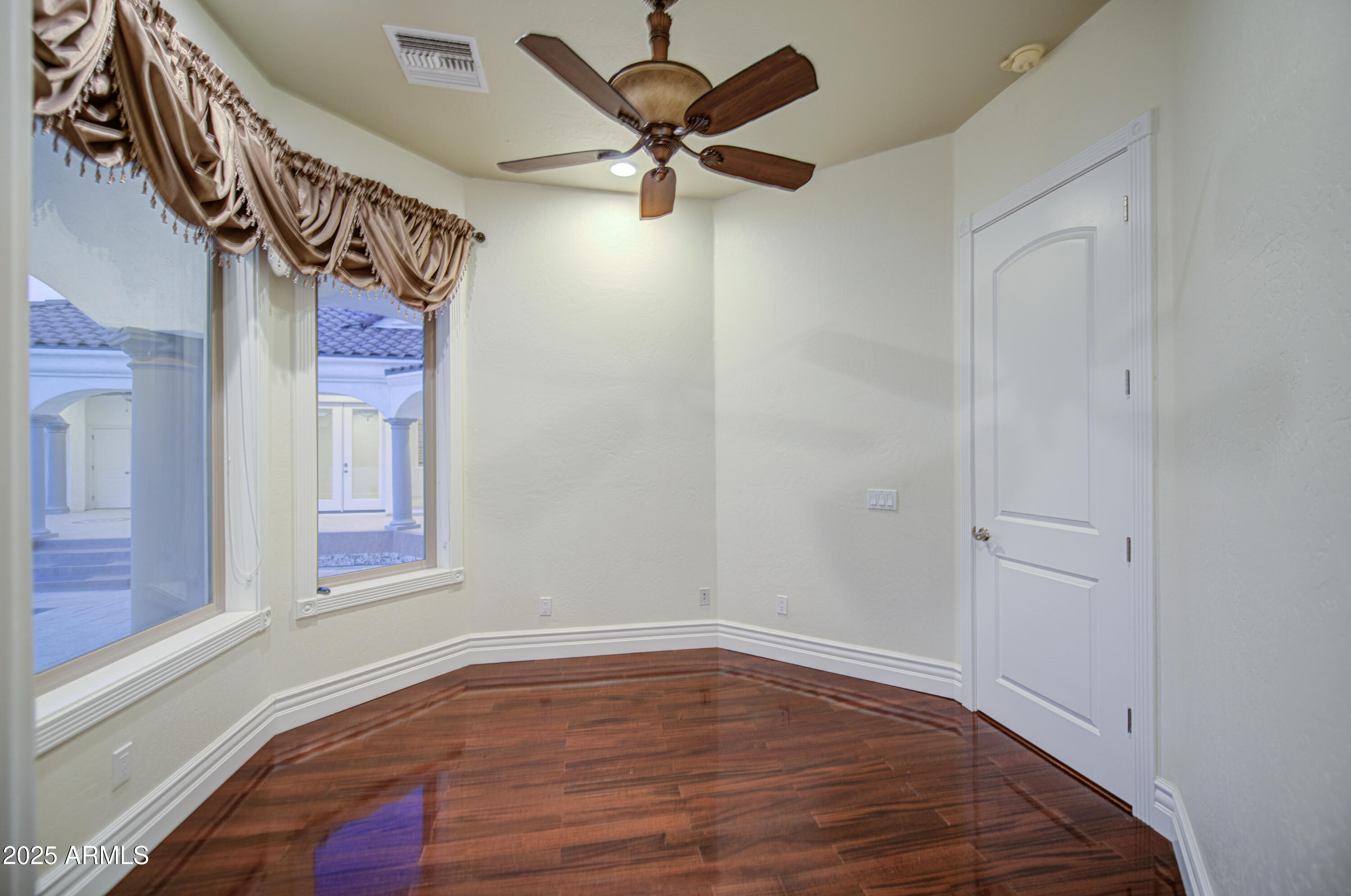 5238 North Explorer Road Apache Junction, AZ 85119 - Photo 42 of 109 a view of a livingroom with a ceiling fan and wooden floor