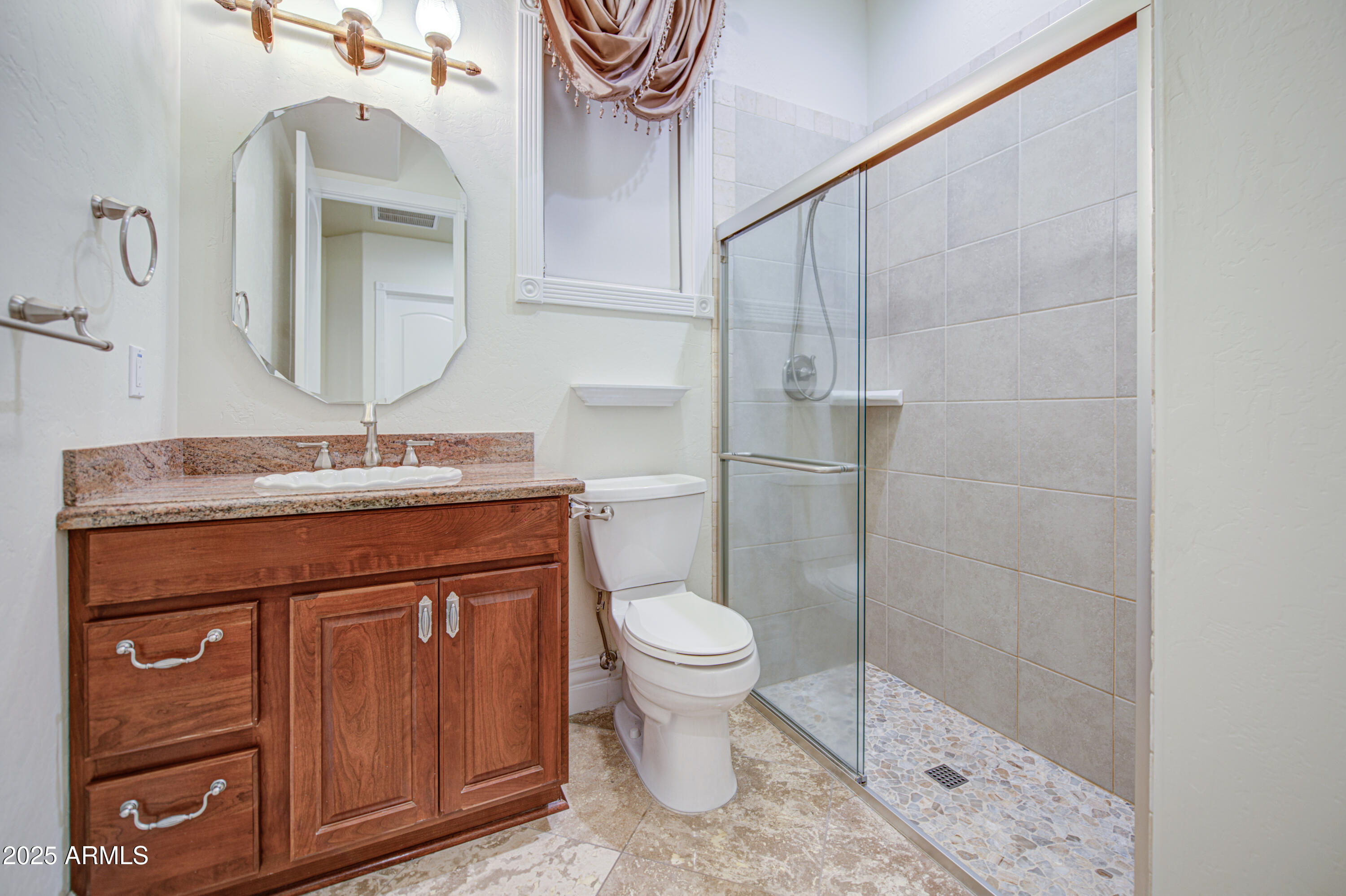 5238 North Explorer Road Apache Junction, AZ 85119 - Photo 57 of 109 a bathroom with a toilet a sink and mirror