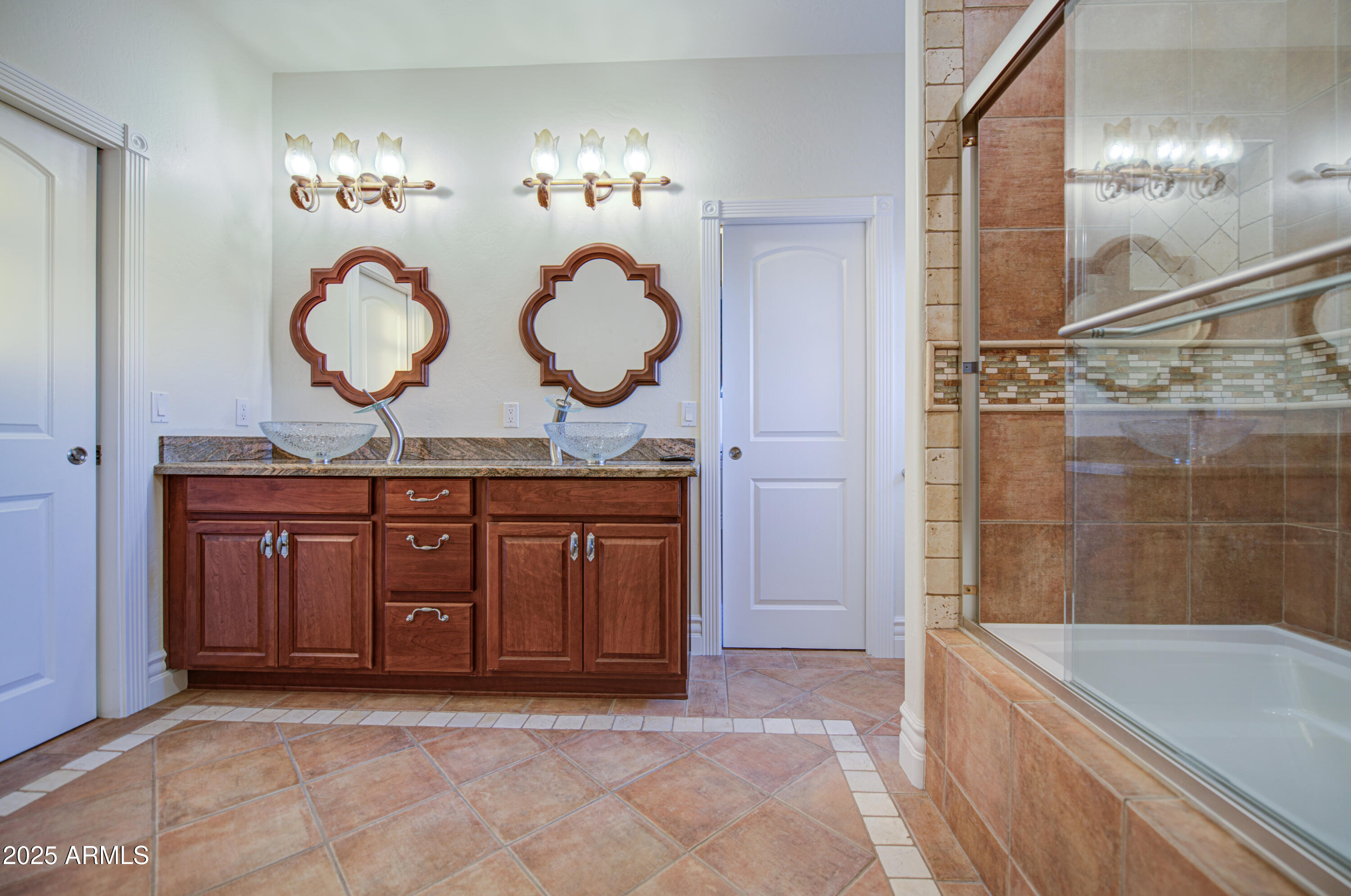 5238 North Explorer Road Apache Junction, AZ 85119 - Photo 58 of 109 a bathroom with a sink a mirror and a bathtub