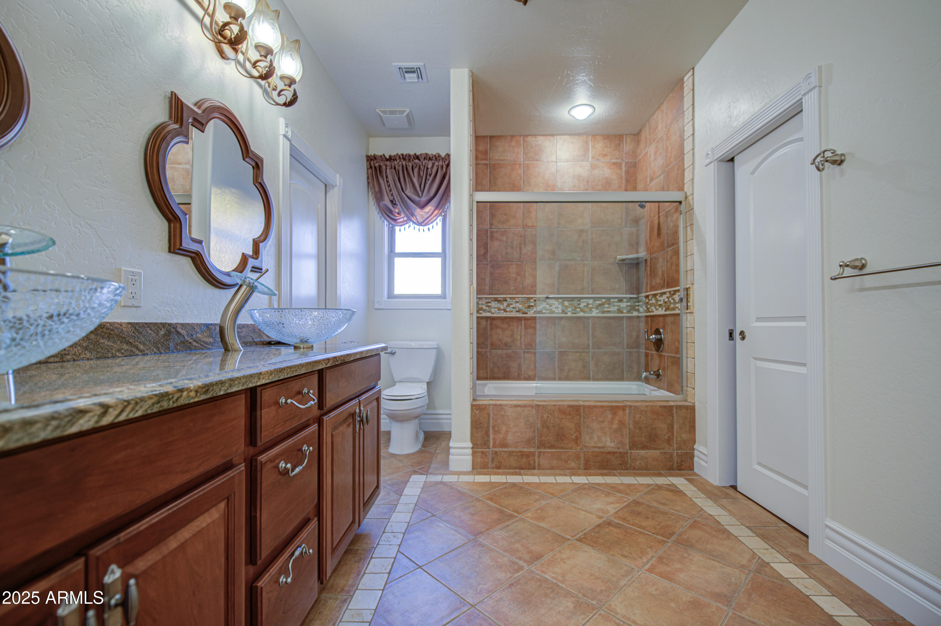 5238 North Explorer Road Apache Junction, AZ 85119 - Photo 59 of 109 a bathroom with a sink a mirror and a shower