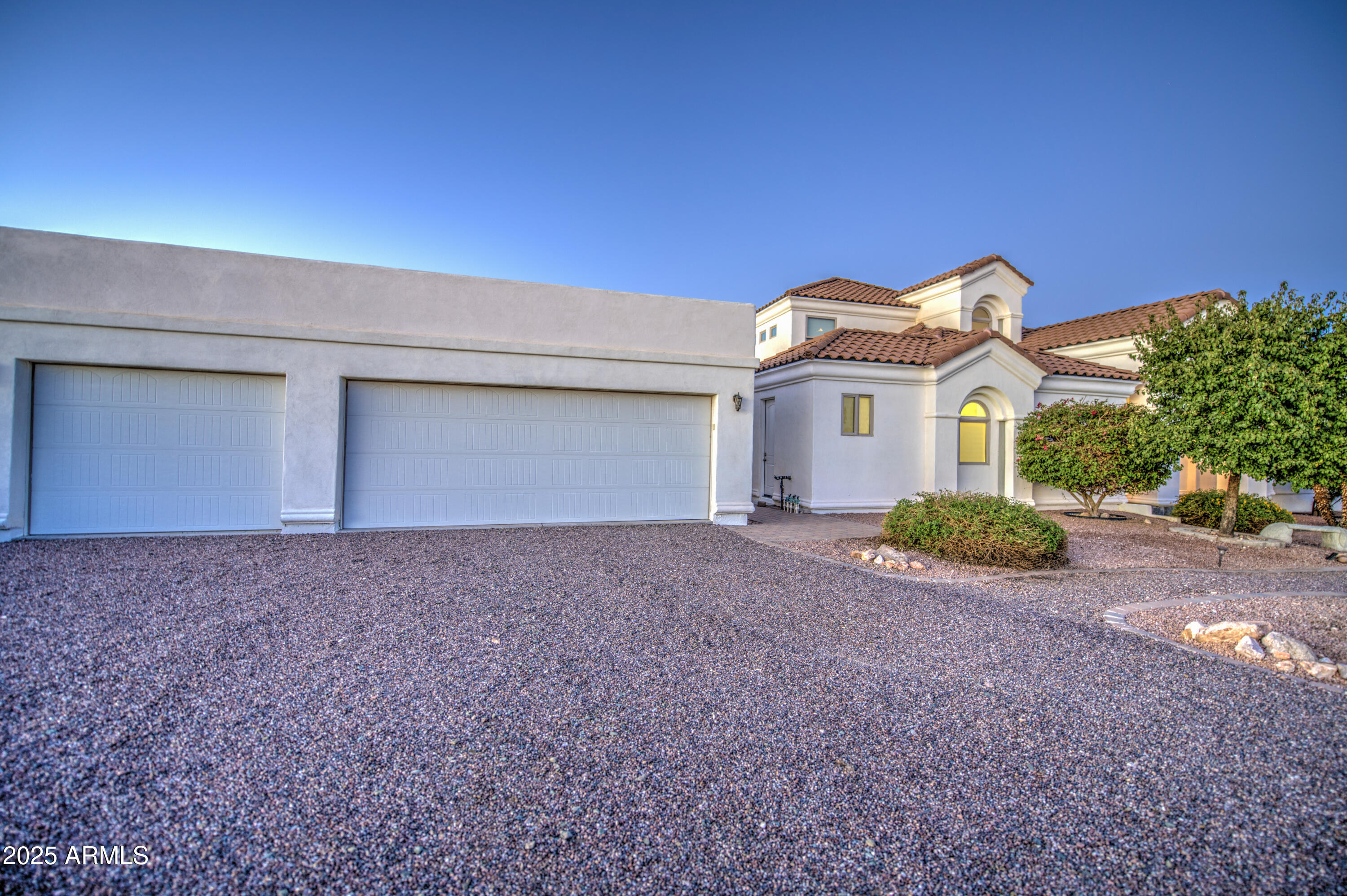 5238 North Explorer Road Apache Junction, AZ 85119 - Photo 84 of 109 a front view of a house with a yard and garage
