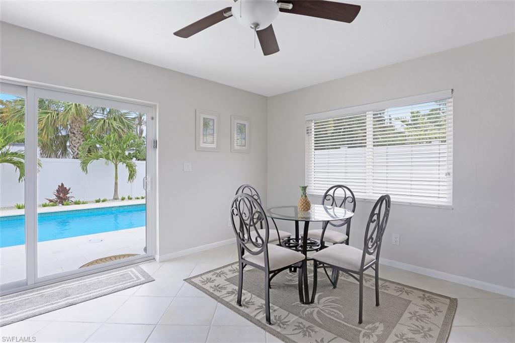 701 93rd Avenue North Naples, FL 34108 - Photo 11 of 33 a view of a dining room with furniture window and outside view