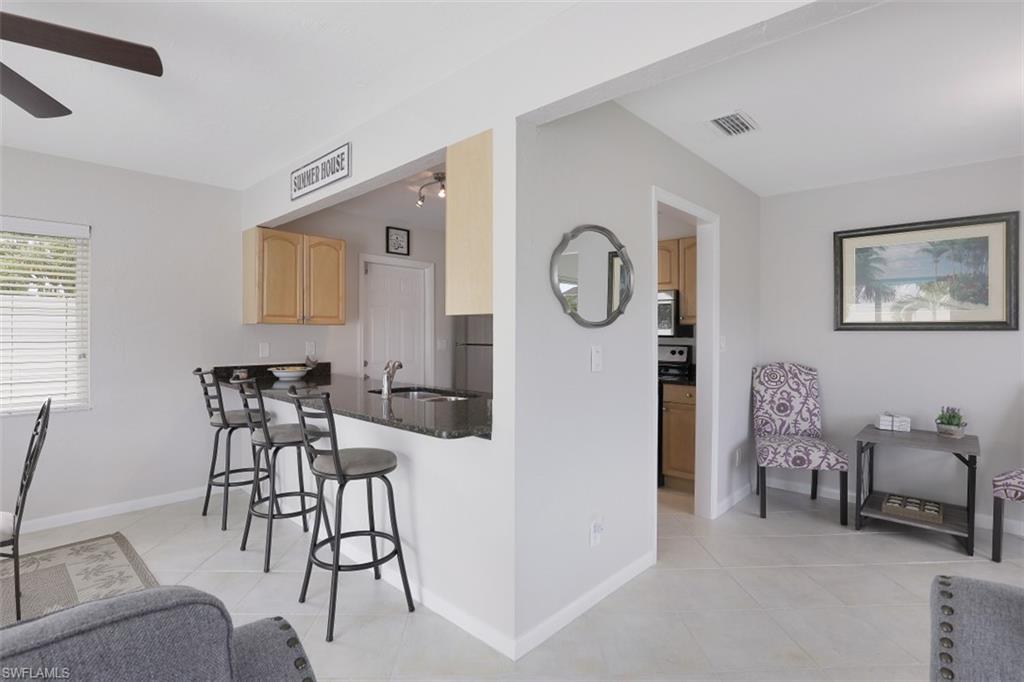 701 93rd Avenue North Naples, FL 34108 - Photo 14 of 33 a view of a livingroom with furniture and a large window