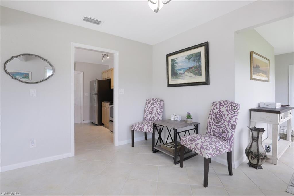 701 93rd Avenue North Naples, FL 34108 - Photo 16 of 33 a living room with furniture and wooden floor