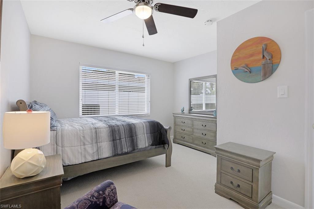 701 93rd Avenue North Naples, FL 34108 - Photo 20 of 33 a bedroom with a bed and a window