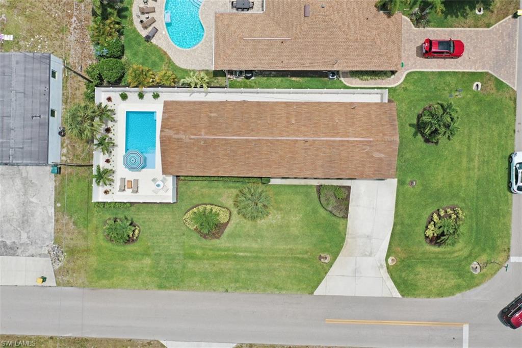 701 93rd Avenue North Naples, FL 34108 - Photo 24 of 33 an aerial view of a back yard
