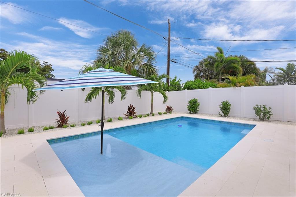 701 93rd Avenue North Naples, FL 34108 - Photo 26 of 33 a view of outdoor space with swimming pool