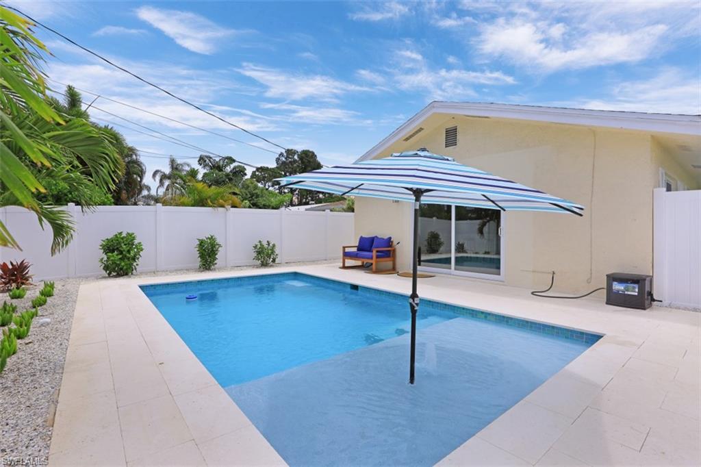 701 93rd Avenue North Naples, FL 34108 - Photo 28 of 33 a view of outdoor space with seating