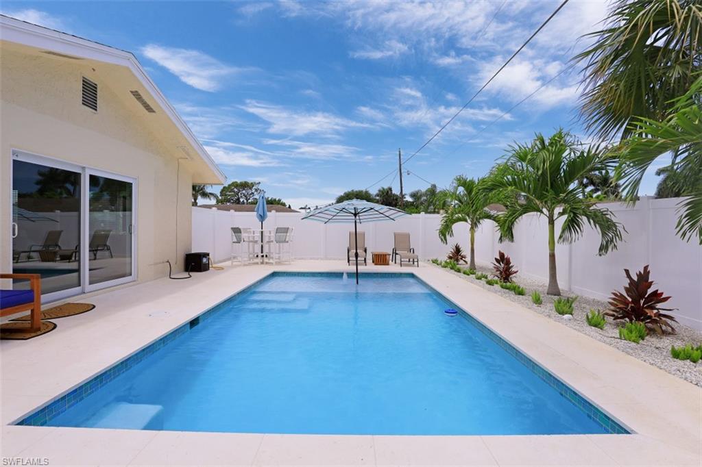 701 93rd Avenue North Naples, FL 34108 - Photo 29 of 33 a view of a living room and hardwood floor
