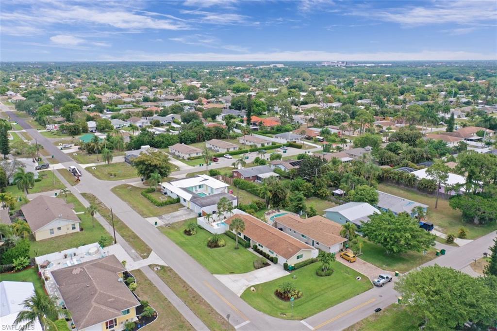 701 93rd Avenue North Naples, FL 34108 - Photo 30 of 33 an aerial view of residential houses with outdoor space and trees