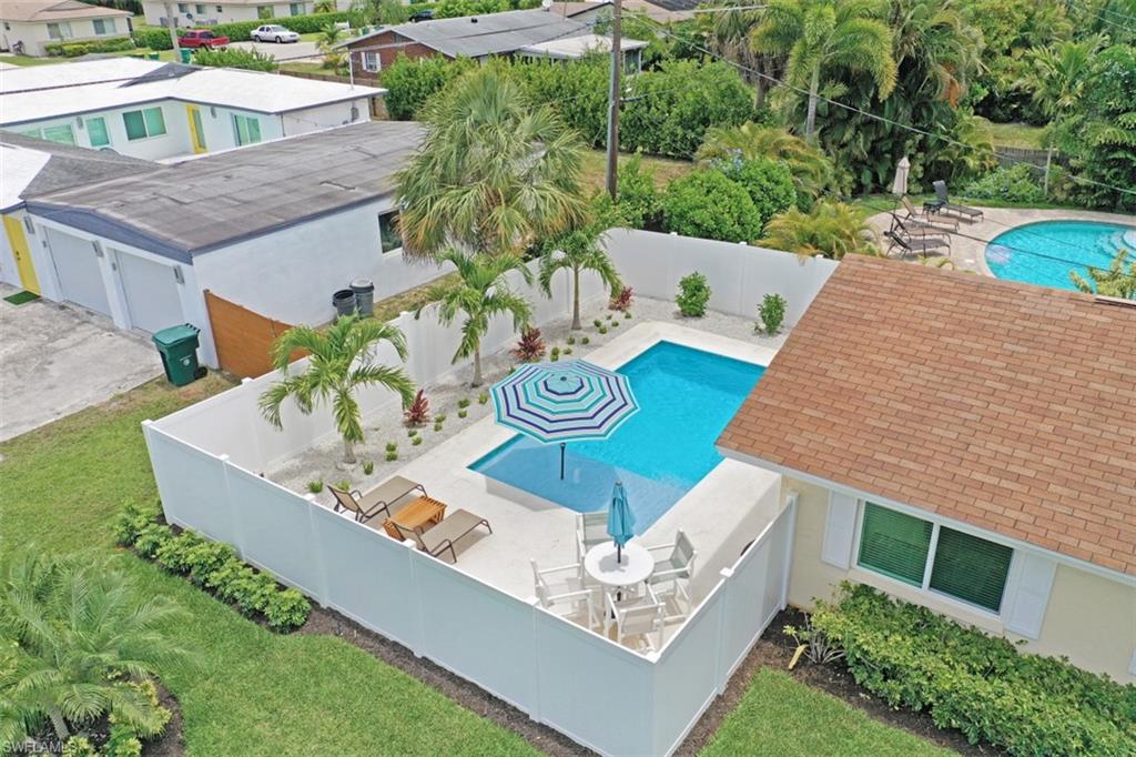 701 93rd Avenue North Naples, FL 34108 - Photo 3 of 33 a picture of table and chairs with potted plants