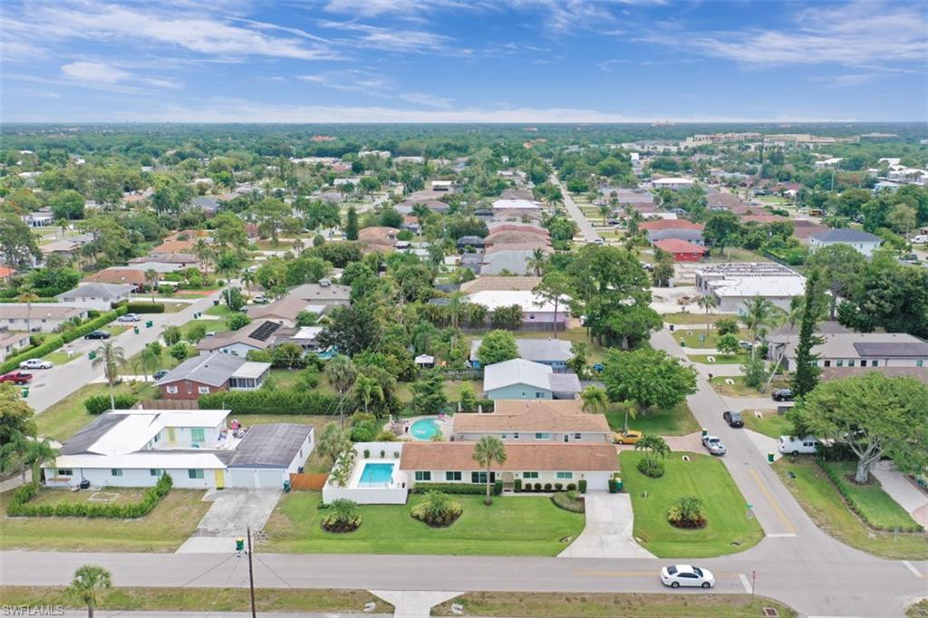 701 93rd Avenue North Naples, FL 34108 - Photo 32 of 33 an aerial view of multiple houses with yard