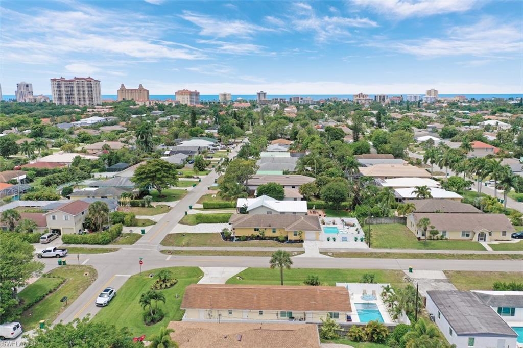 701 93rd Avenue North Naples, FL 34108 - Photo 4 of 33 an aerial view of a city