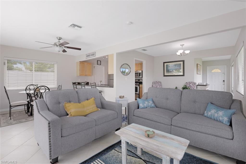 701 93rd Avenue North Naples, FL 34108 - Photo 5 of 33 a living room with furniture and a table