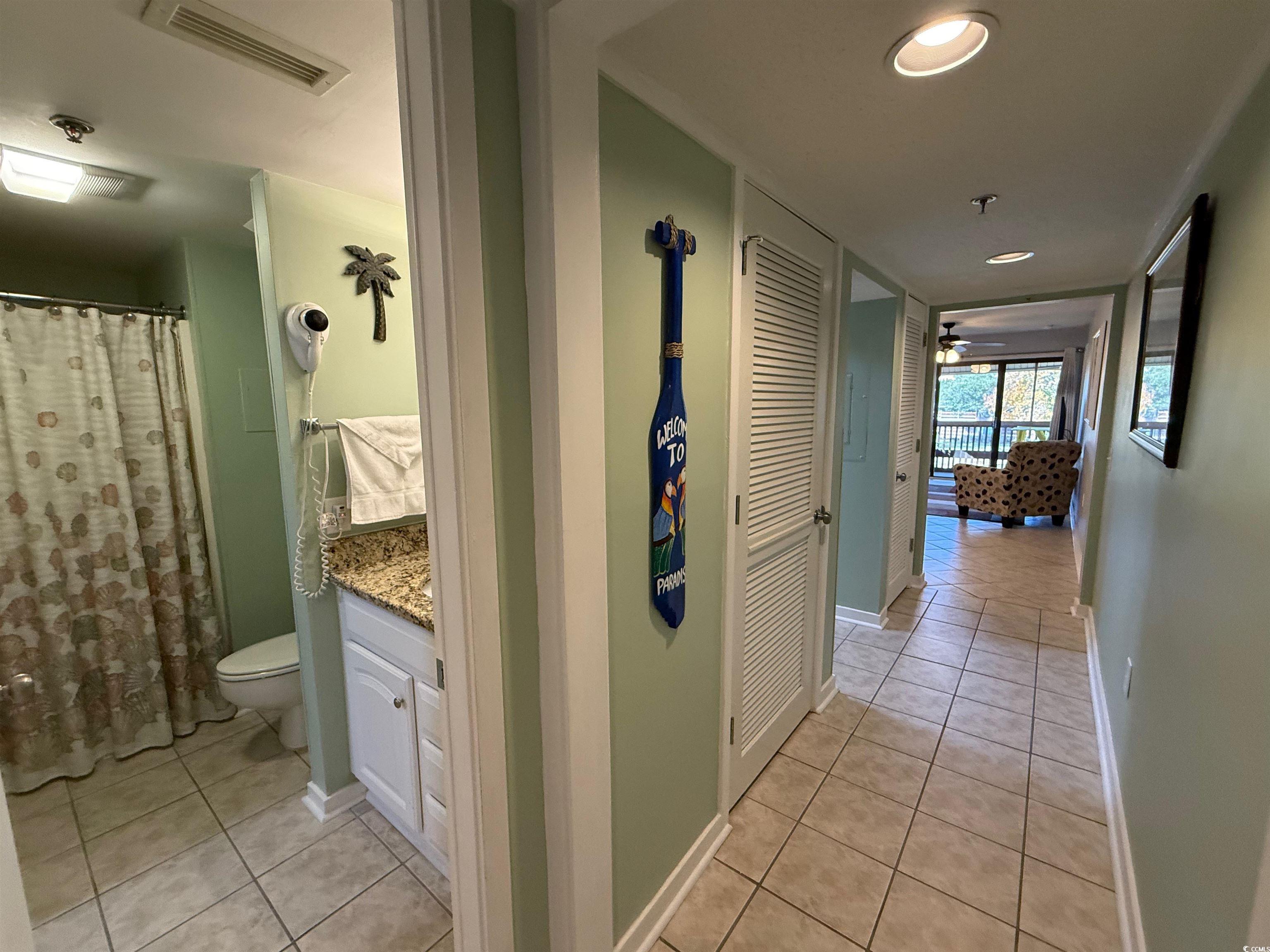 410 Melrose Place, Unit 310 Myrtle Beach, SC 29572 - Photo 30 of 39 Hall featuring light tile patterned floors and recessed lighting
