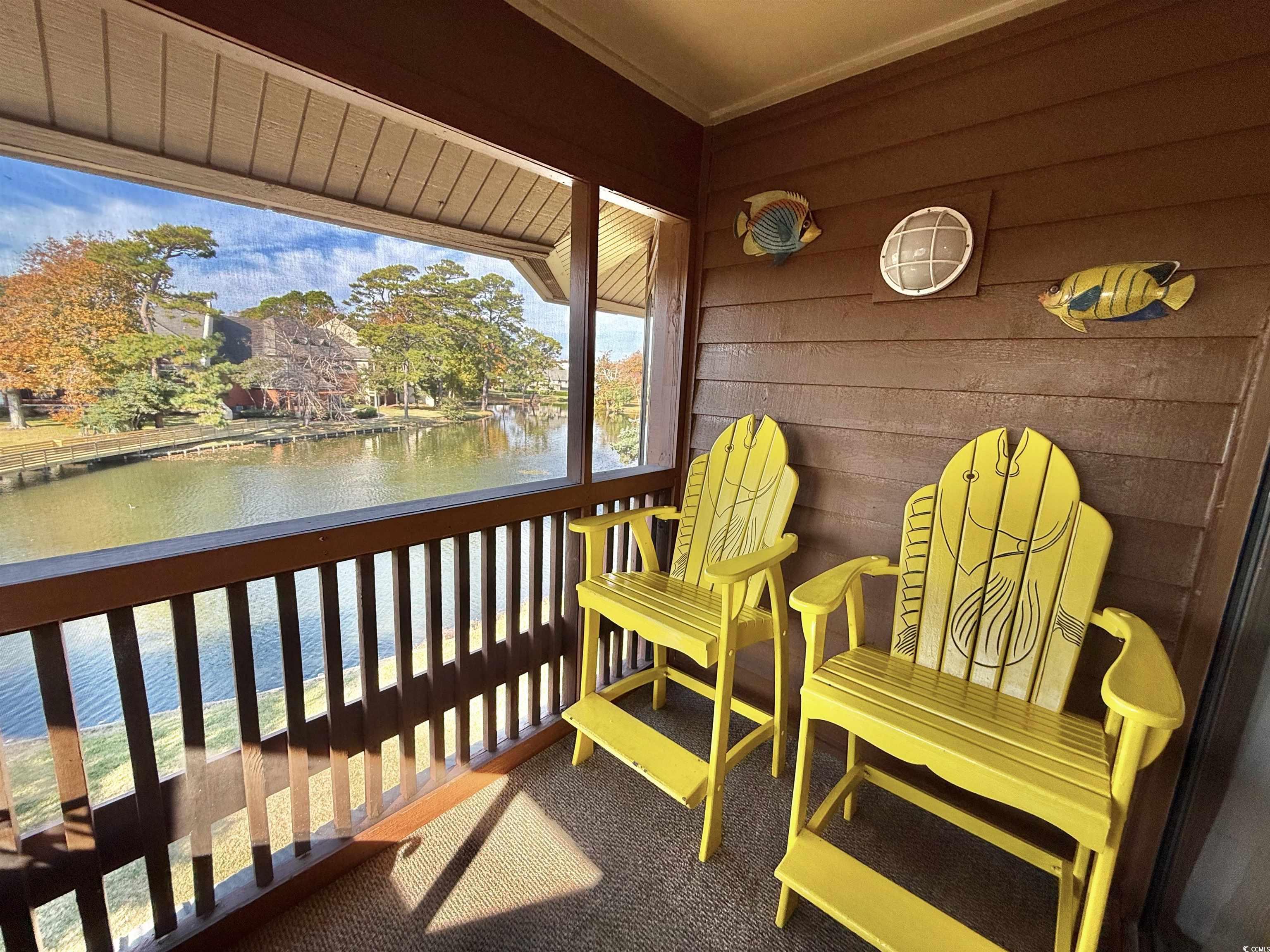 410 Melrose Place, Unit 310 Myrtle Beach, SC 29572 - Photo 8 of 39 Balcony featuring a water view