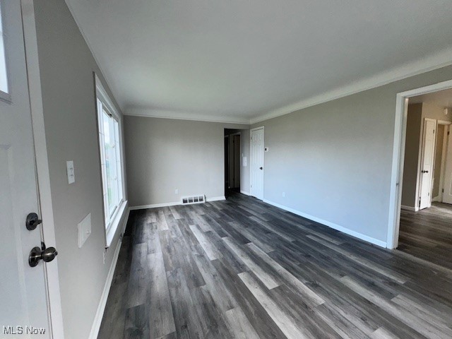 28846 Alton Road Wickliffe, OH 44092 - Photo 15 of 27 Unfurnished living room featuring baseboards, visible vents, and dark wood finished floors