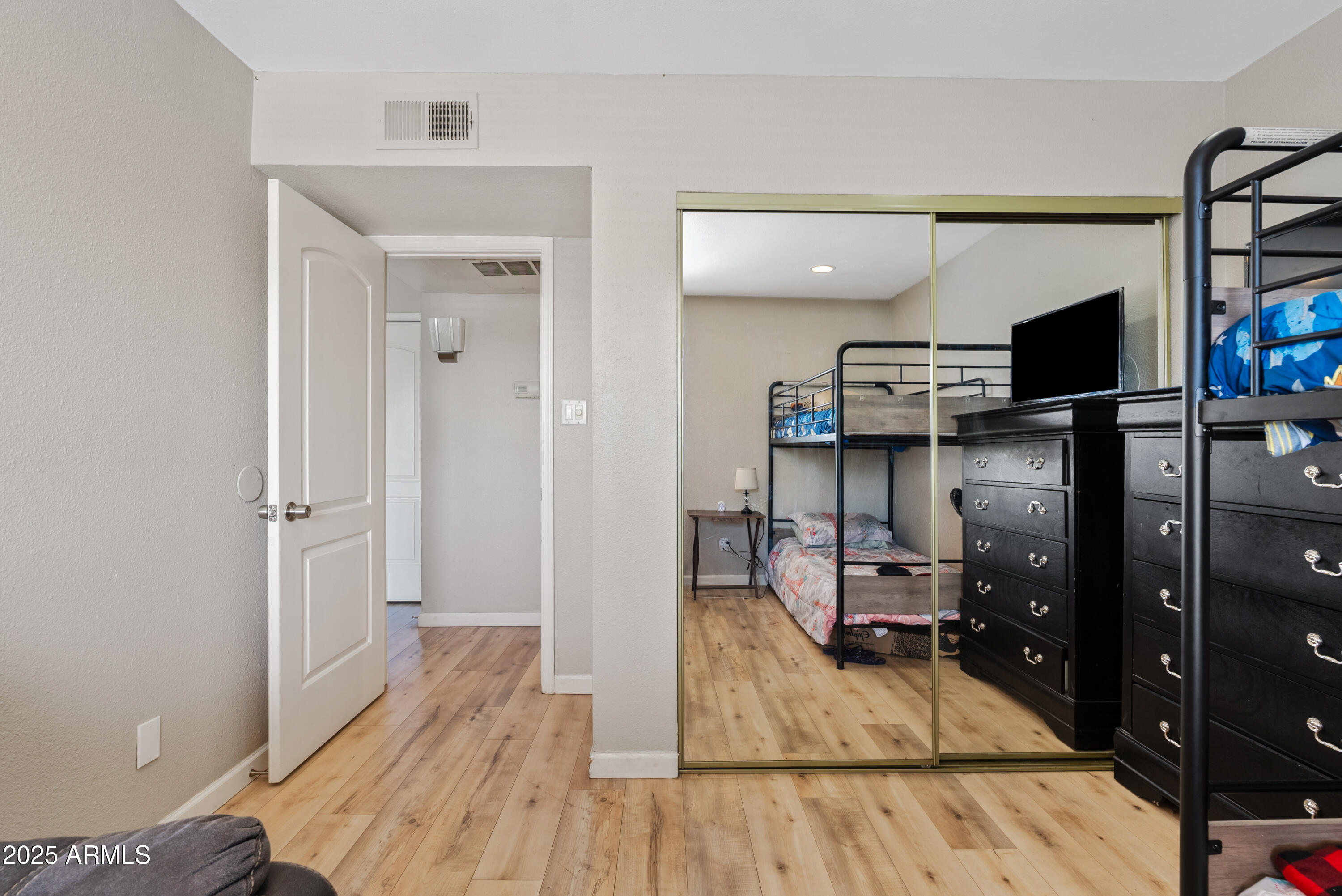 4410 North Longview Avenue, Unit 224 Phoenix, AZ 85014 - Photo 11 of 23 a view of a livingroom with wooden floor
