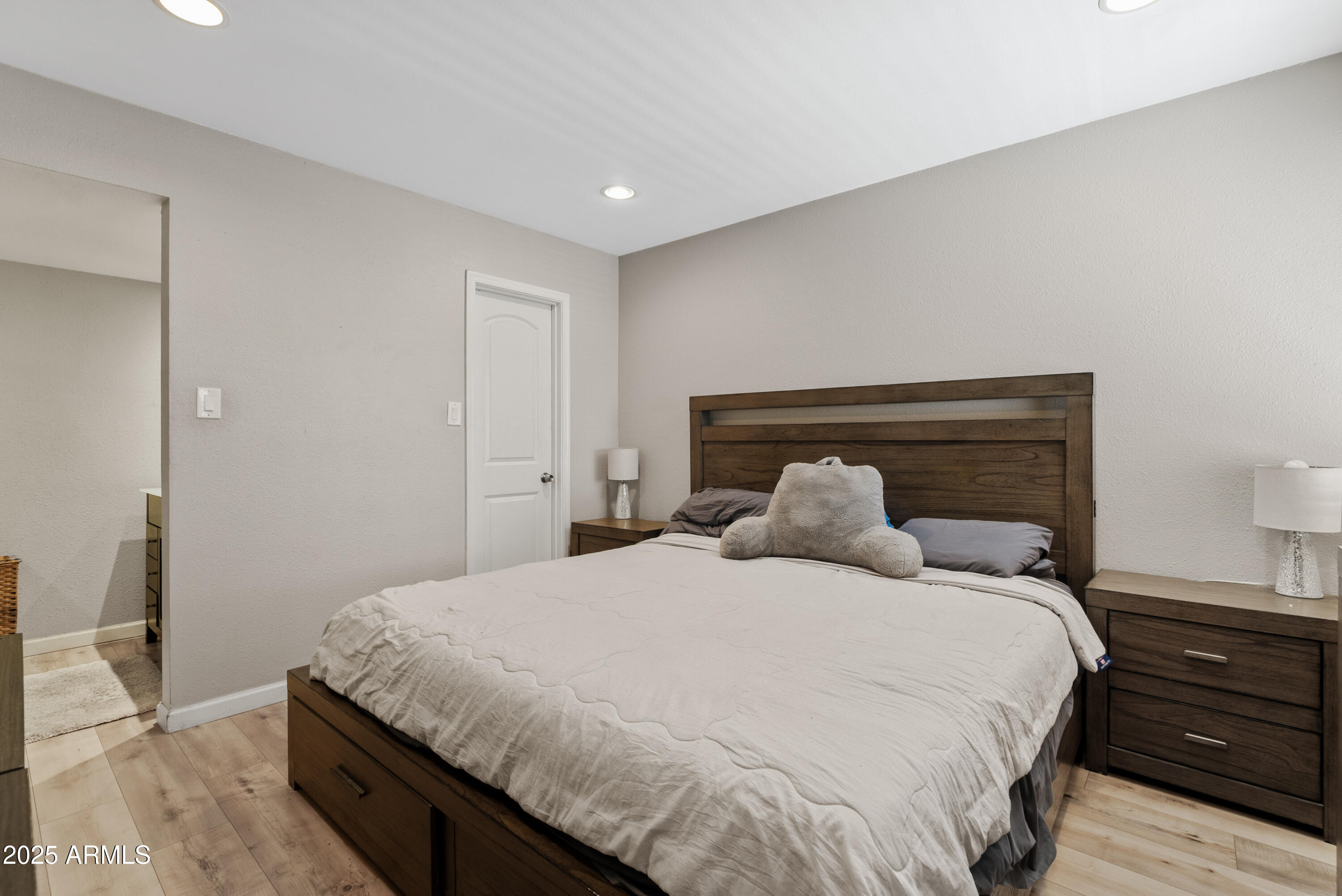 4410 North Longview Avenue, Unit 224 Phoenix, AZ 85014 - Photo 12 of 23 a bedroom with a bed and wooden floor