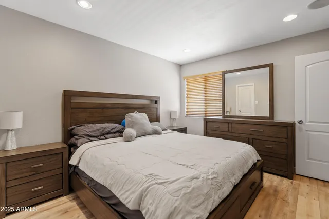 a bedroom with a bed and a window