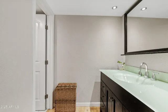 a bathroom with a sink and a mirror