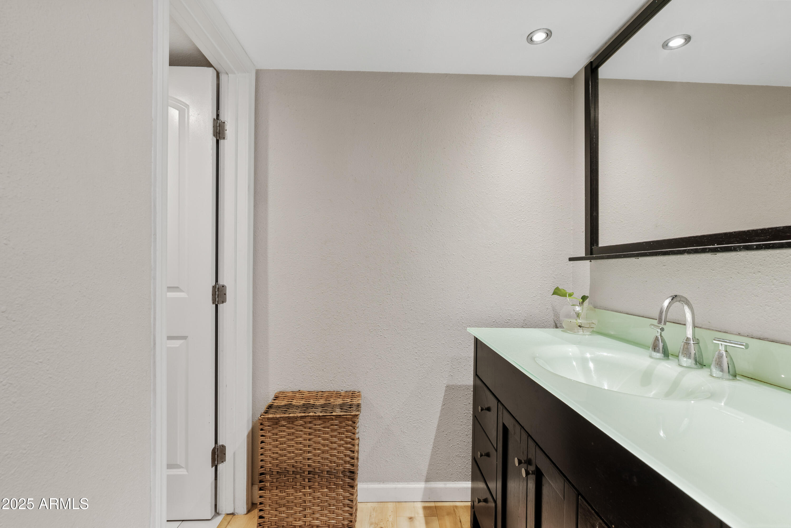4410 North Longview Avenue, Unit 224 Phoenix, AZ 85014 - Photo 15 of 23 a bathroom with a sink and a mirror
