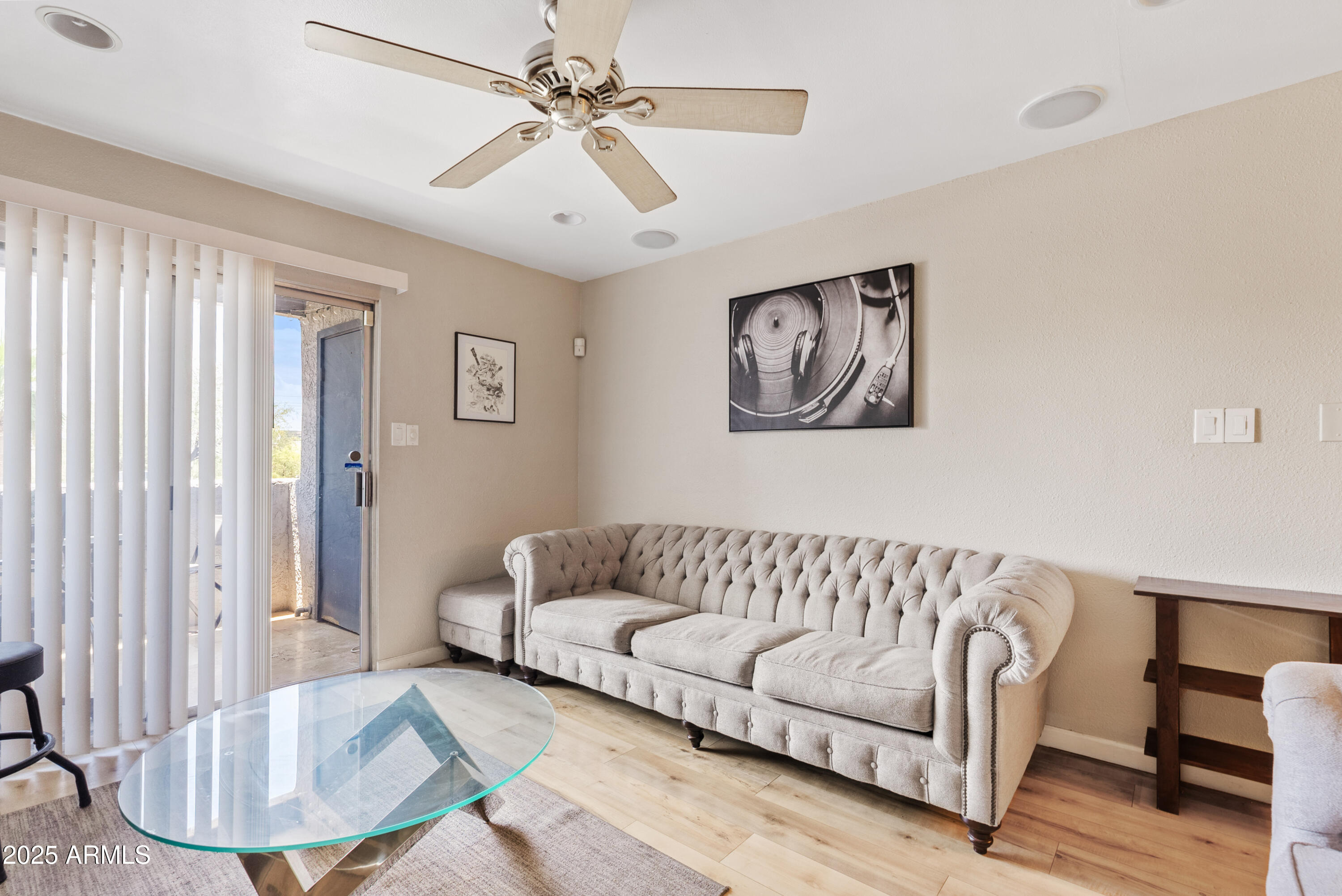 4410 North Longview Avenue, Unit 224 Phoenix, AZ 85014 - Photo 2 of 23 a living room with furniture and a painting