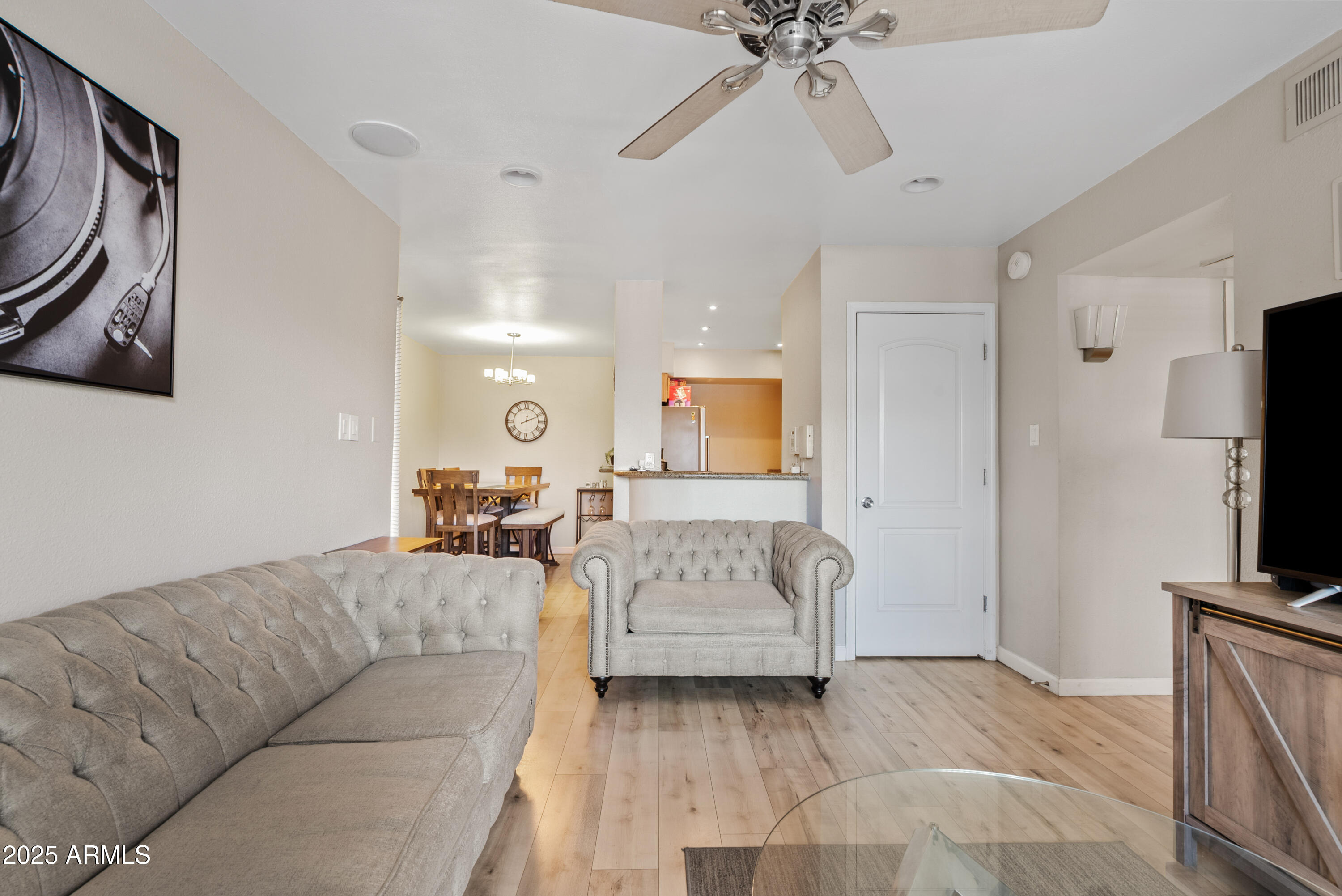 4410 North Longview Avenue, Unit 224 Phoenix, AZ 85014 - Photo 5 of 23 a living room with furniture and a flat screen tv