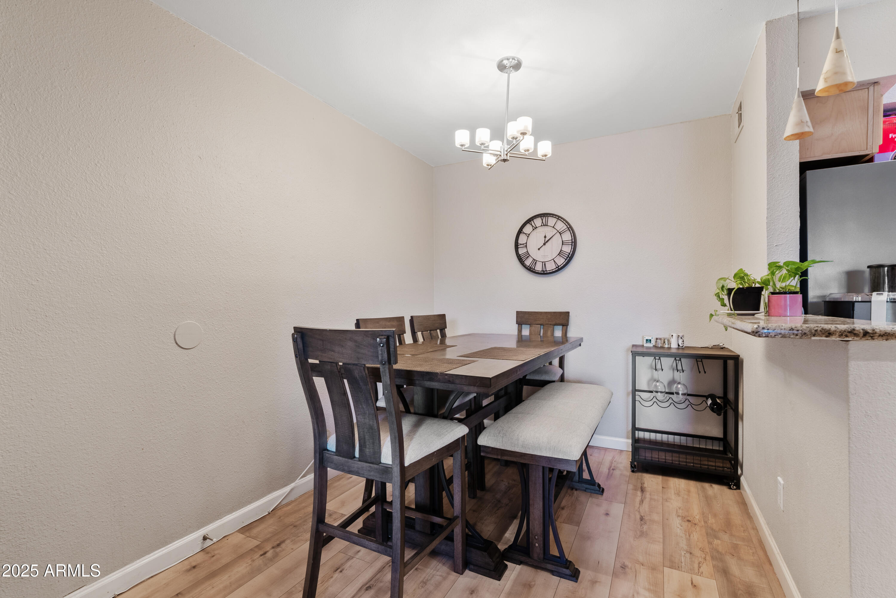 4410 North Longview Avenue, Unit 224 Phoenix, AZ 85014 - Photo 6 of 23 a view of a dining room with furniture and chandelier