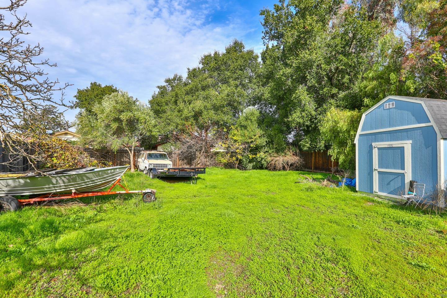 5121 Bucknall Road San Jose, CA 95130 - Photo 11 of 26 a backyard of a house with lots of green space