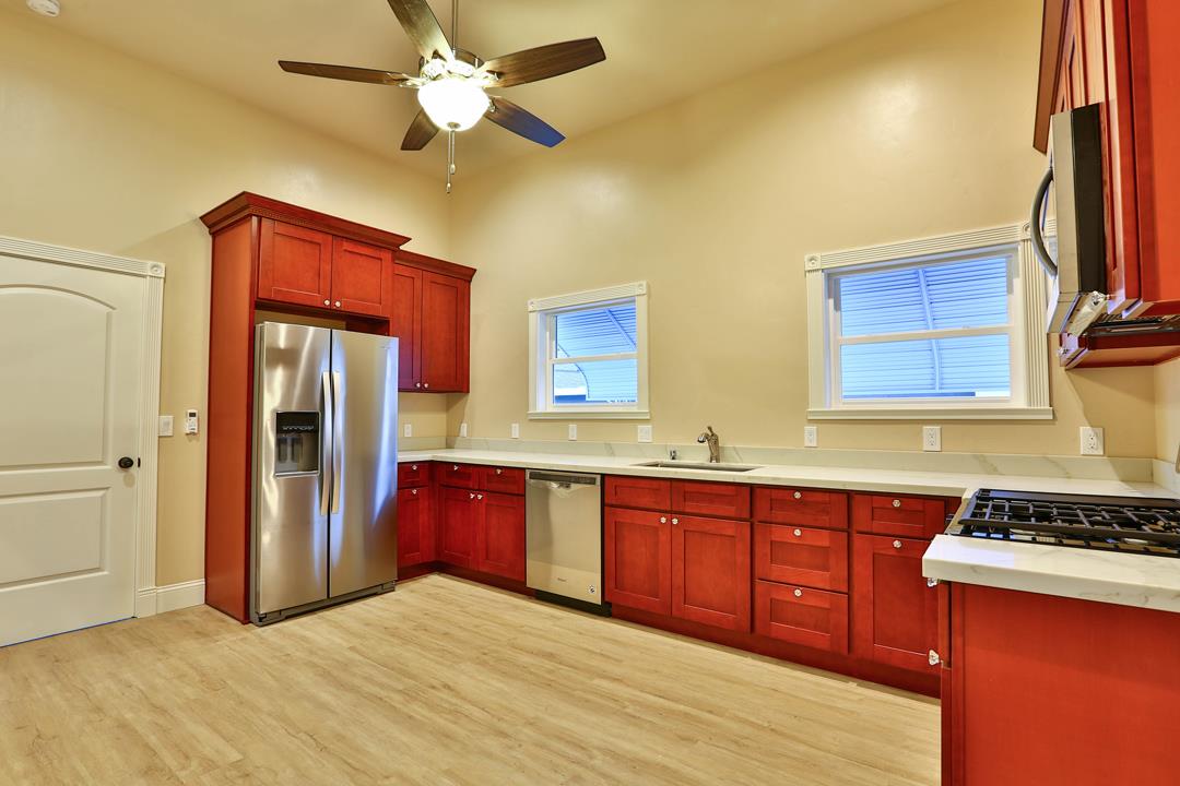 5121 Bucknall Road San Jose, CA 95130 - Photo 15 of 26 a kitchen with stainless steel appliances granite countertop a stove sink and cabinets