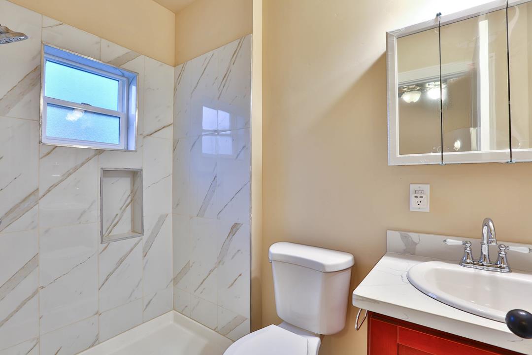 5121 Bucknall Road San Jose, CA 95130 - Photo 20 of 26 a bathroom with a sink and mirror with toilet